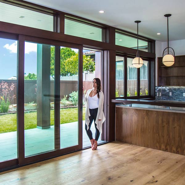 woman standing in in sliding door way